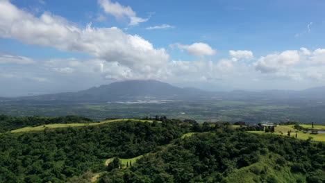 cinematic drone hyperlapse timelapse of clouds moving over the land on a sunny day, aerial, philippines, asia