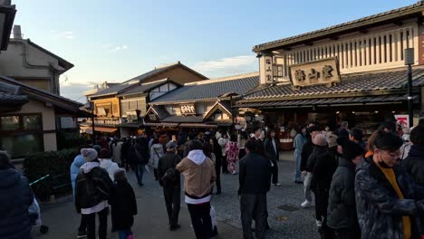 crowded market street with diverse visitors and shops