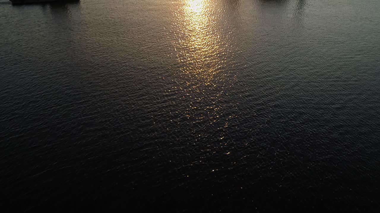 Tugboat And Hydraulic Equipment With A Golden Sunset And Reflection At The Baltic Sea In Darlowko, Poland