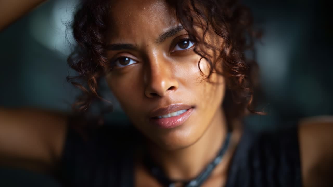 A Woman's Emotional Journey: Capturing Intense Expressions in Two Frames, Transitioning from Vulnerability to Strength through Subtle Changes in Facial Emotion