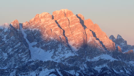 sunset light over the high dolomite mountains above cortina d'ampezzo, italy.