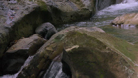 Small-waterfall-flowing-over-rocks-in-the-Cajones-de-Chame,-Panama,-serene-natural-scene