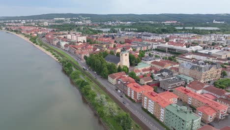 Beautiful-aerial-scenic-view-of-church-on-Lake-Vattern-lakeside-and-Jonkoping-cityscape,-Sweden