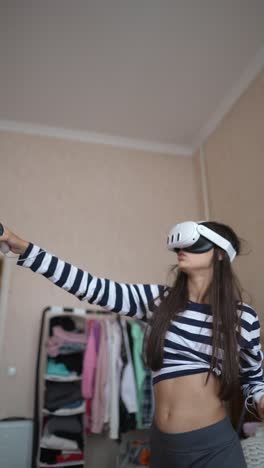 teenager playing vr game at home