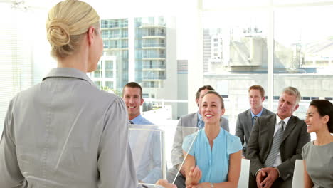 Businesswoman-asking-question-during-conference