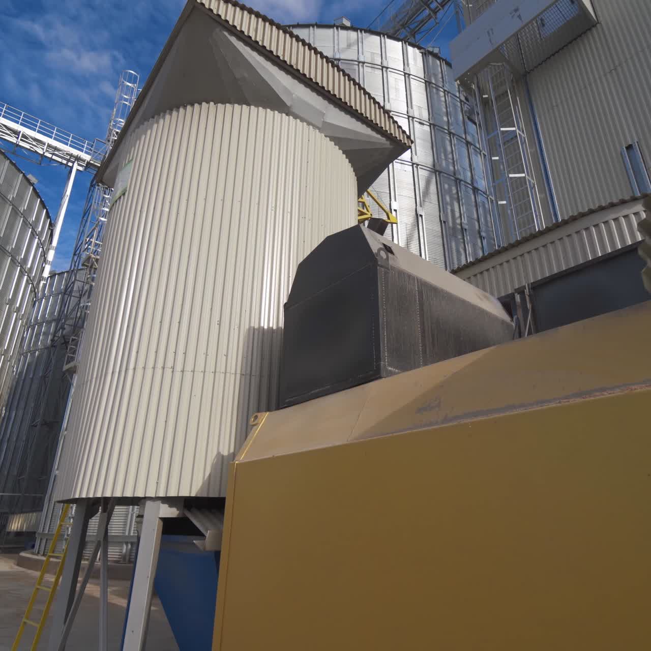Large industrial plant with special equipment for processing crop. Industrial oven in the agricultural factory. Exterior of grain dryers farm
