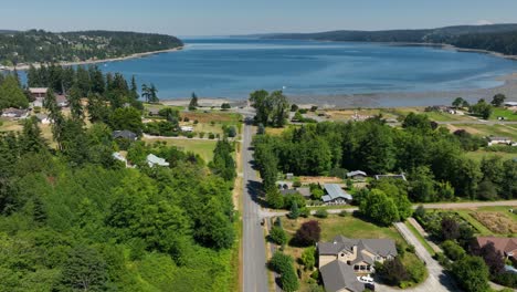 aerial shot flying down freeland's main street towards holmes harbor on whidbey island