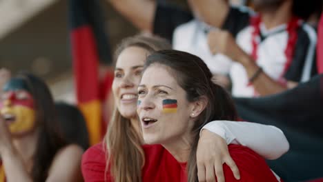 excited german fans cheering for their national team