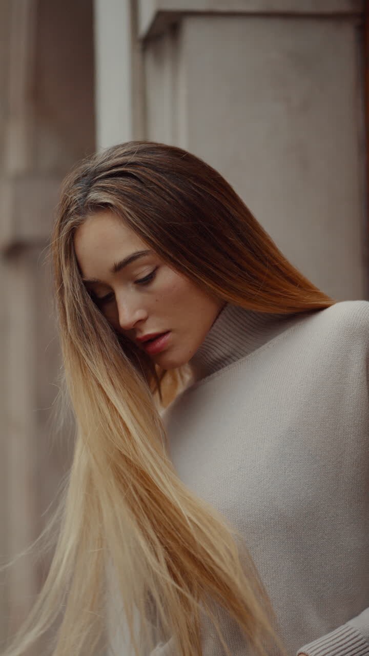 Woman in a sweater outdoors