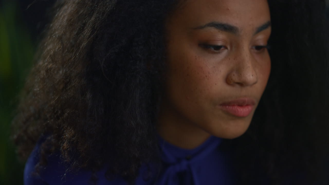African american businesswoman discussing marketing on video call in cafe office