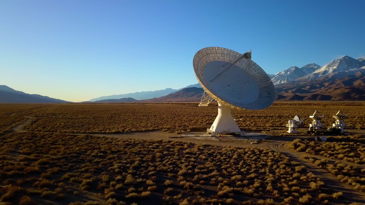 Aerial view around a large space telescope array, in California, USA - circling, drone shot