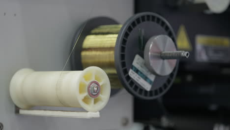 close-up of wire spool on a machine