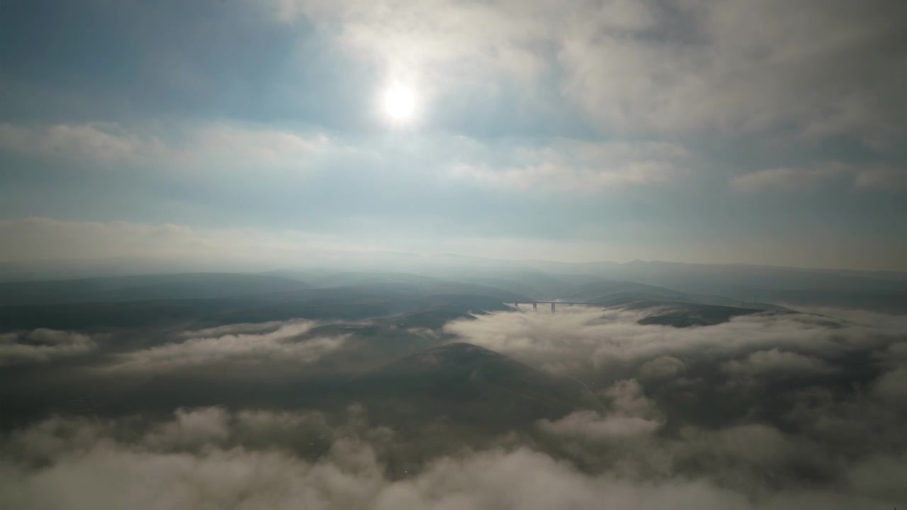 Aerial Time Lapse of Clouds Clearing Over Rolling Hills