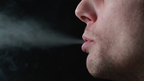 man smoking cigarette