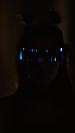 woman wearing light-up glasses