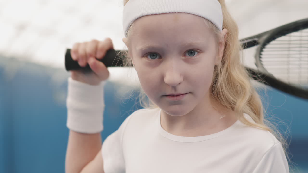 Portrait Of Little Female Tennis Player