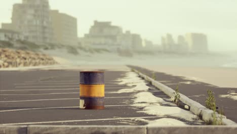 old and rusty metal barrel on parking