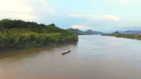 mekong river landscape with cargo ship