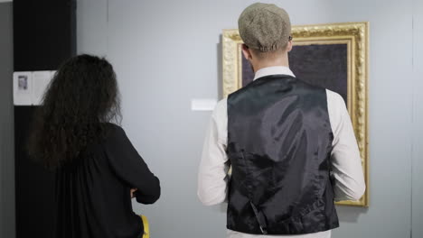 people viewing art in a gallery