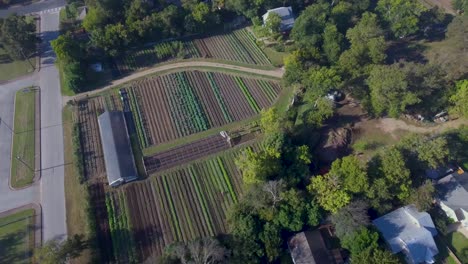 aerial: 360 rotating view of a working farm in austin, texas