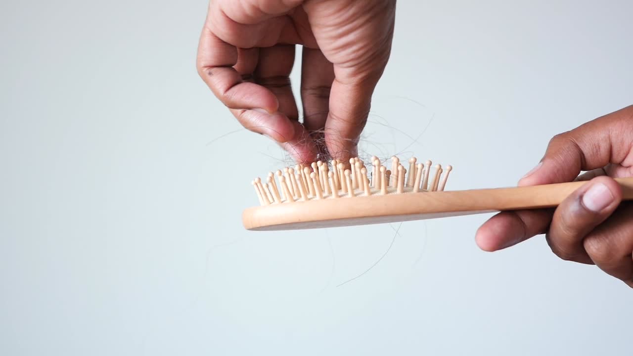 Man hold his list hair close up ,