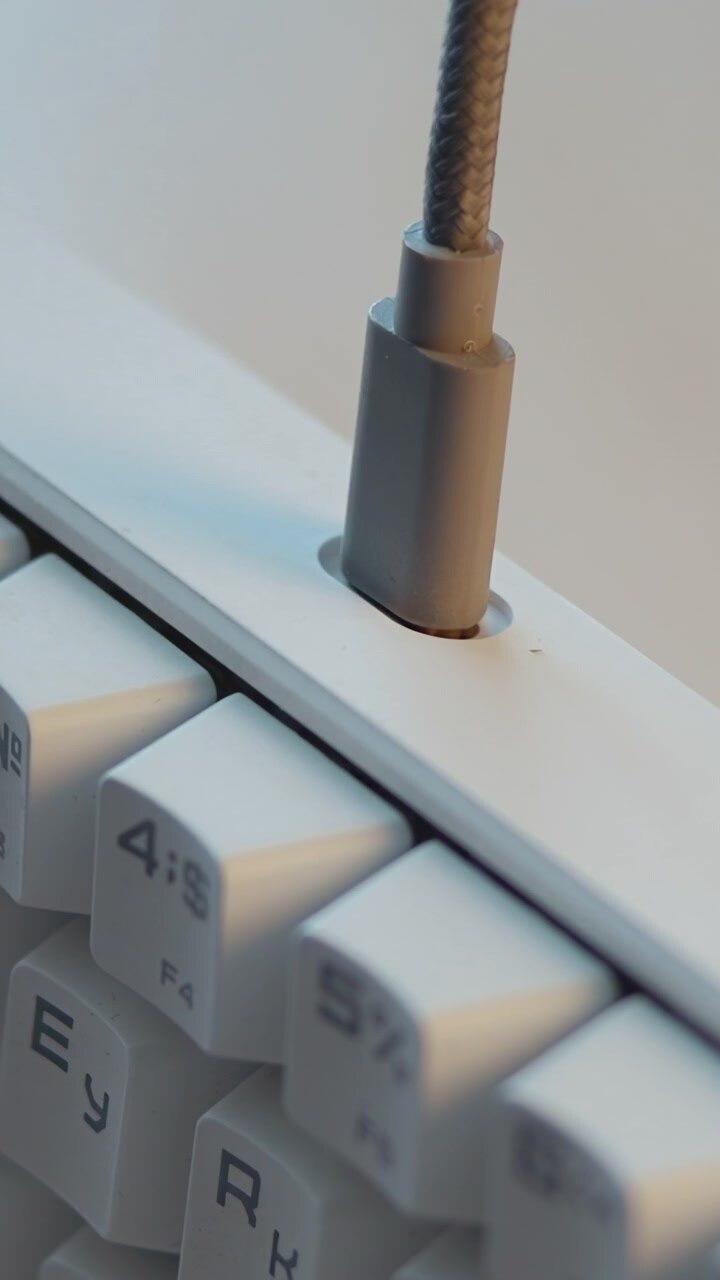 White Hand Inserting Cable Into Mechanical Keyboard Port, Close Detail On Keys And Connector, Tech Setup . Media