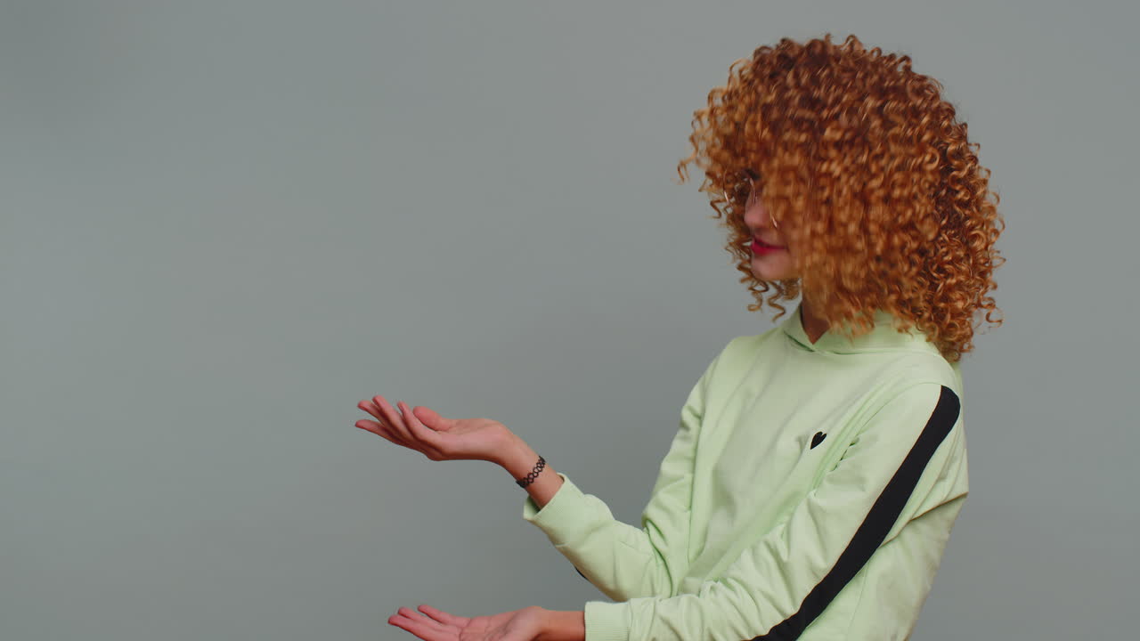 Girl child pointing empty place advertising area for commercial text copy space for goods promotion