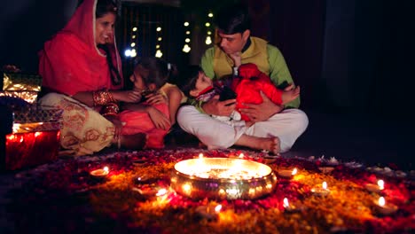 parents with kids celebrate the indian traditional festival of diwali