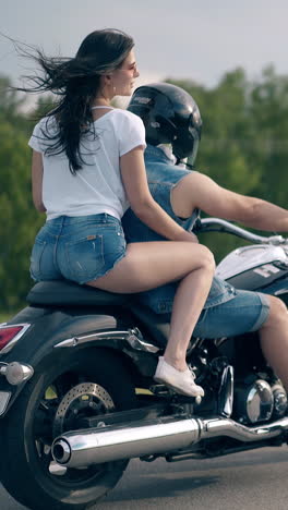 couple riding motorcycle
