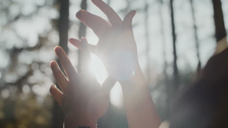 Hands-of-woman-gesturing-in-forest