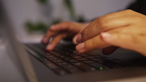 person typing on laptop keyboard