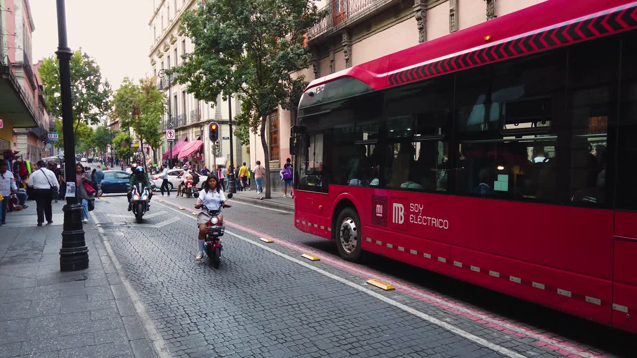 Slow-motion shot of the everyday activities on a Friday afternoon in a street in the historic center of Mexico City