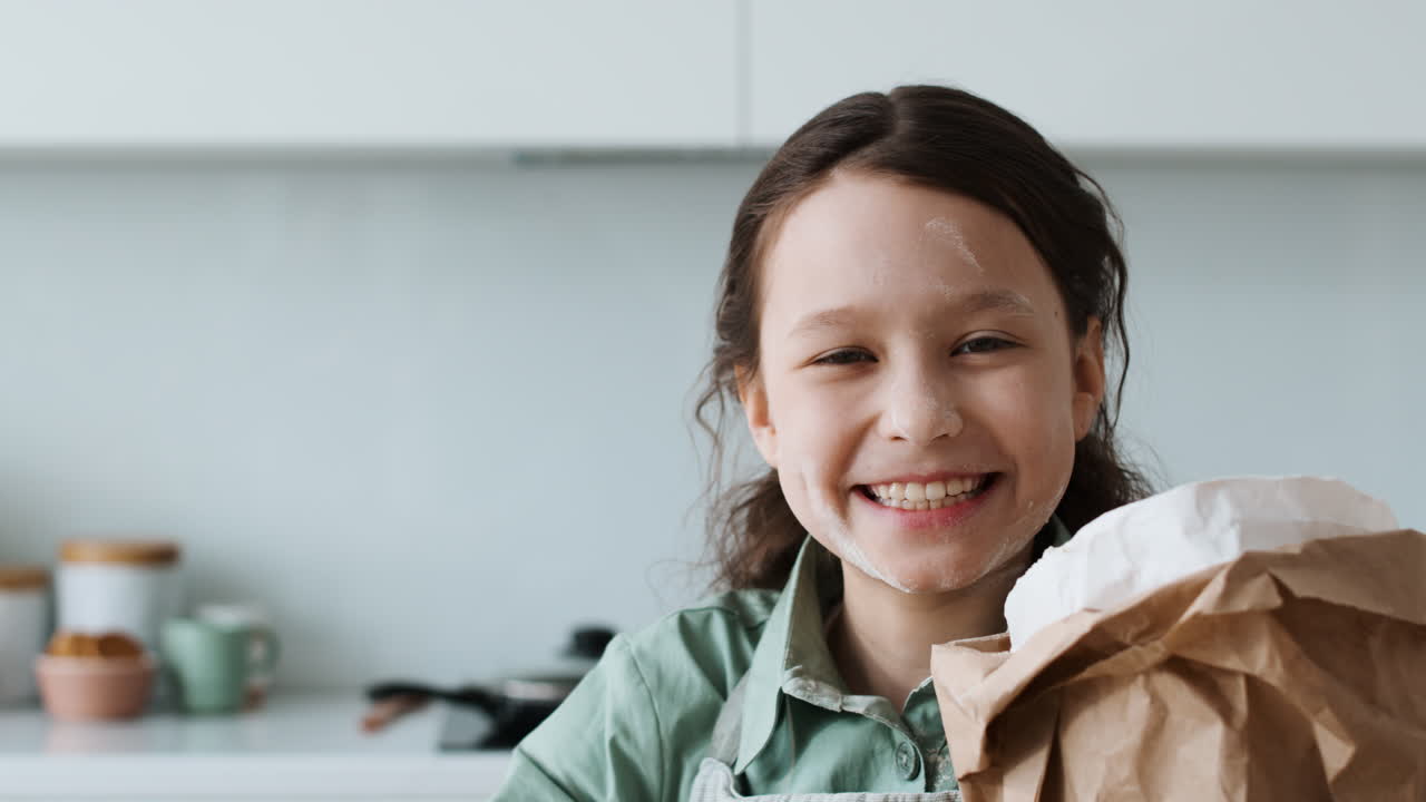 Girl laughing in the kitchen