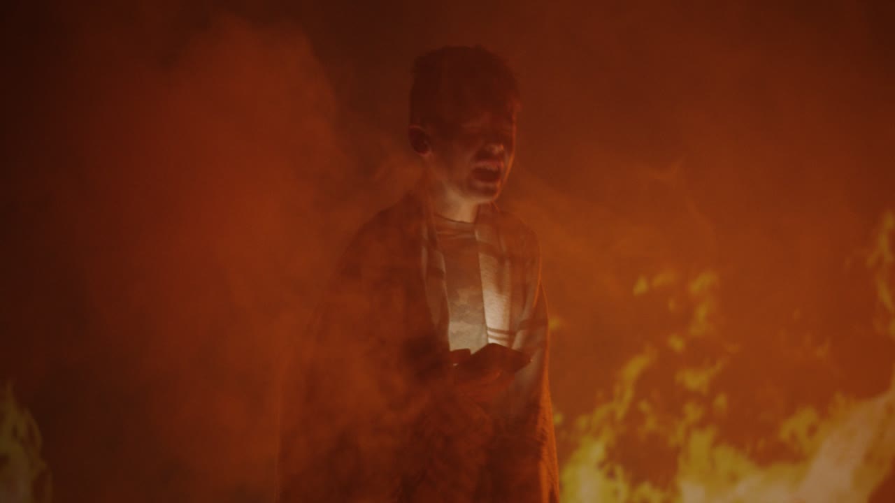 Figure Amidst Fire and Smoke