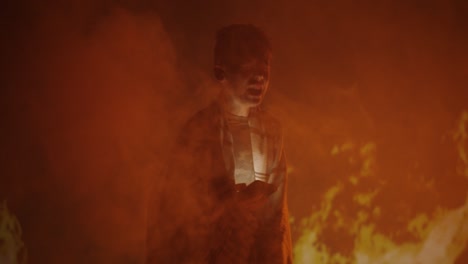 figure amidst fire and smoke