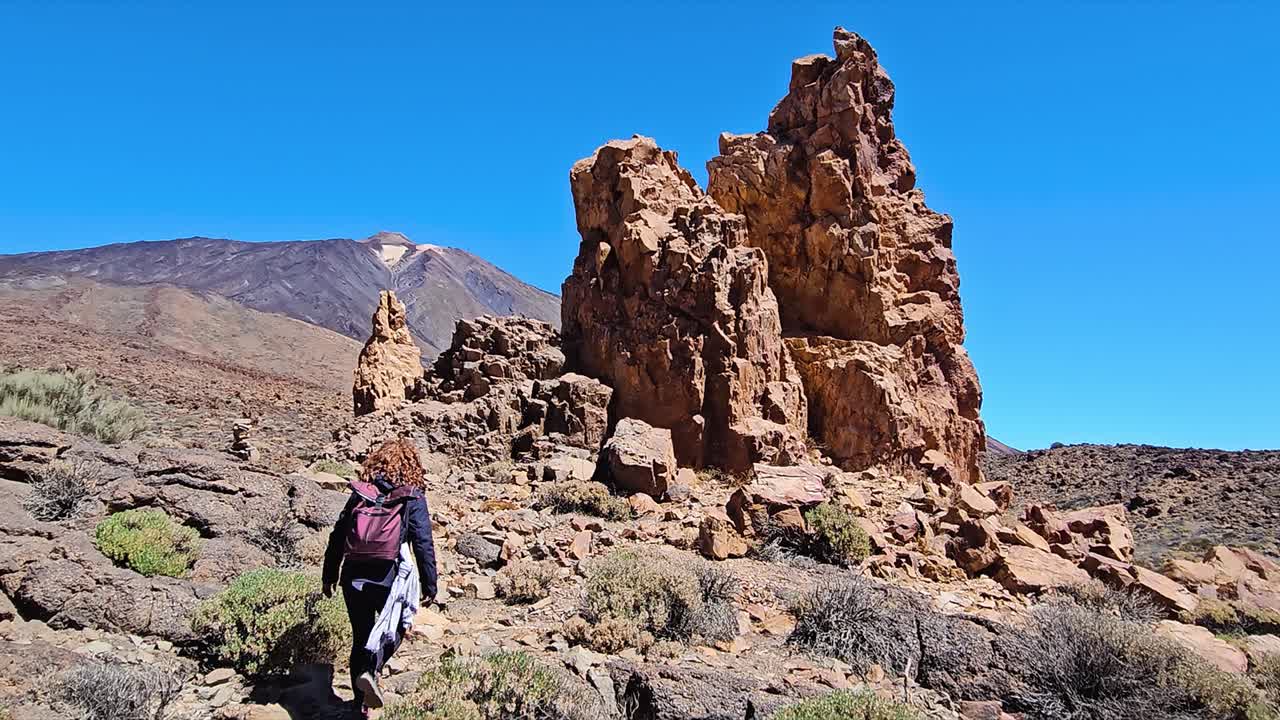 Stunning rocky landscape of Roques de Garcia, with a hiker walking through nature