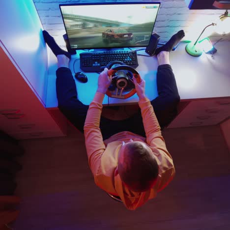 male gamer playing racing game