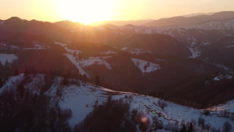 sunset over the village of bran during the winter