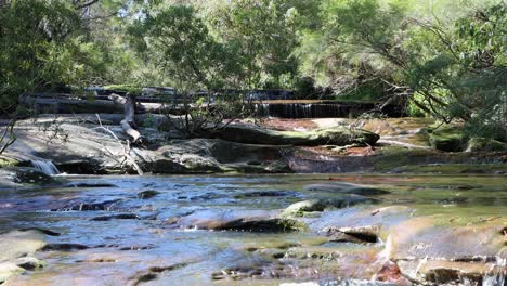 somersby falls stone slabs close to sydney australia in the brisbane water national park, locked wide shot