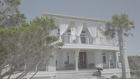 two-story beachfront accommodation with beautiful white curtains exterior shot