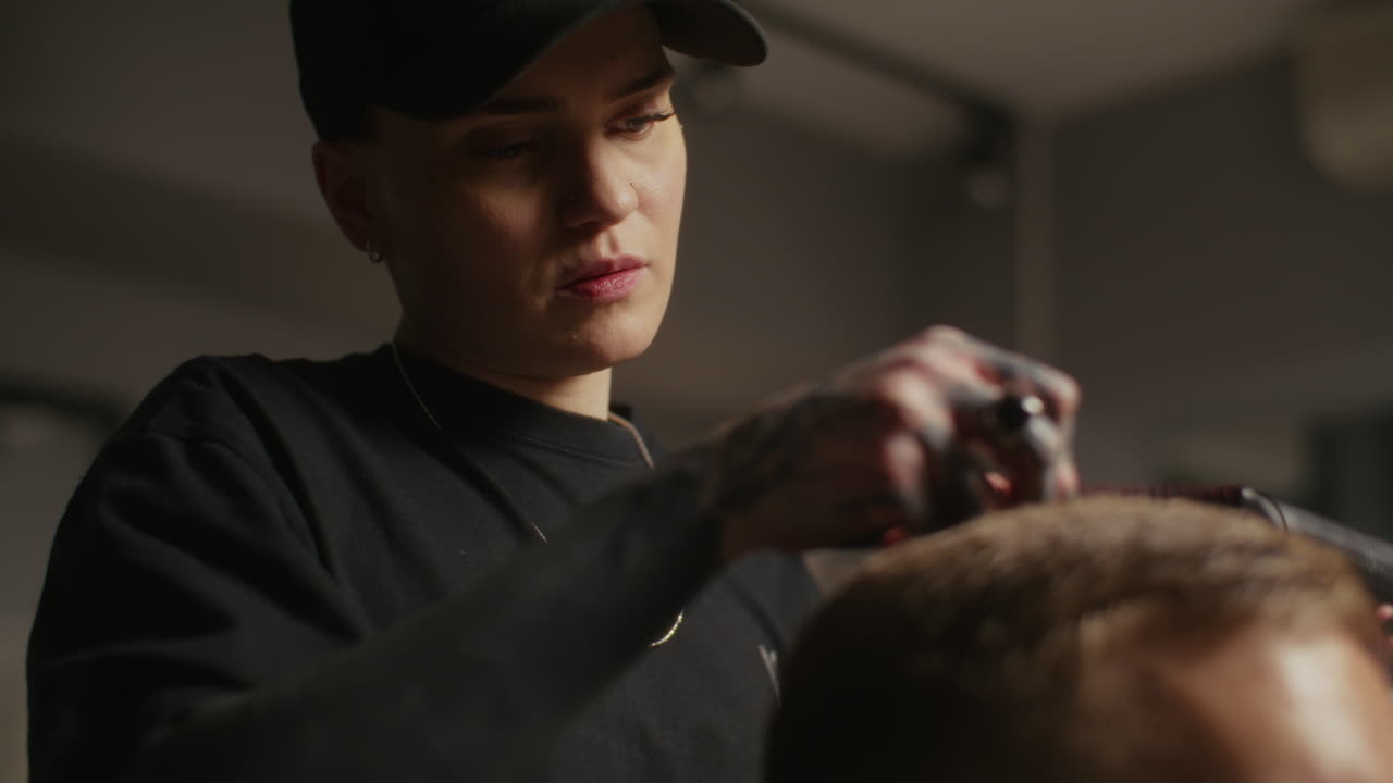 Woman Barber Giving a Haircut