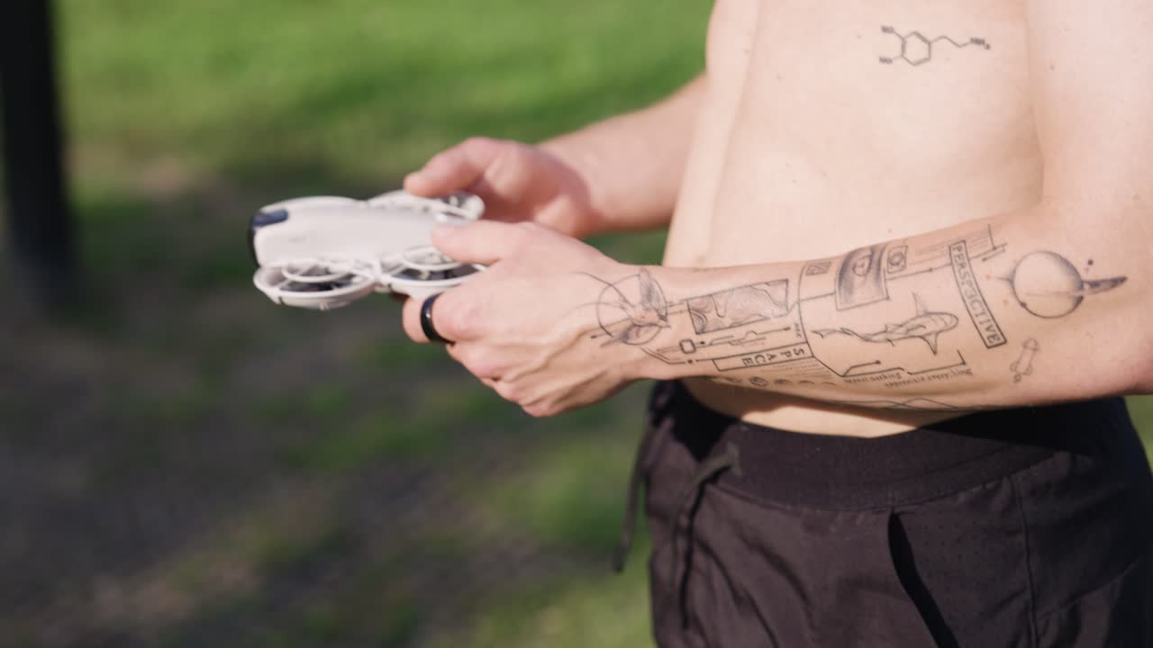 Caucasian male take out compact drone gadget from pocket, Czechia