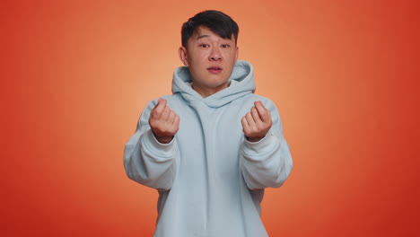 rich man showing wasting or throwing money around hand gesture more tips dreaming about big profit