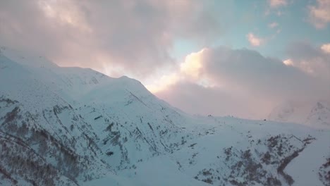 {aerial} drone view to a mountain pic on cloudy sunset