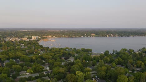 aerial establishing shot of beautiful lake geneva, wisconsin in summer