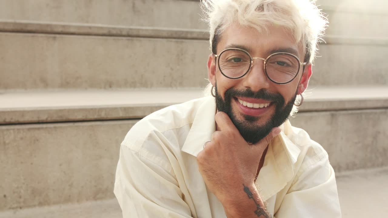 Close-up Portrait of a Smiling Man with Glasses and Beard