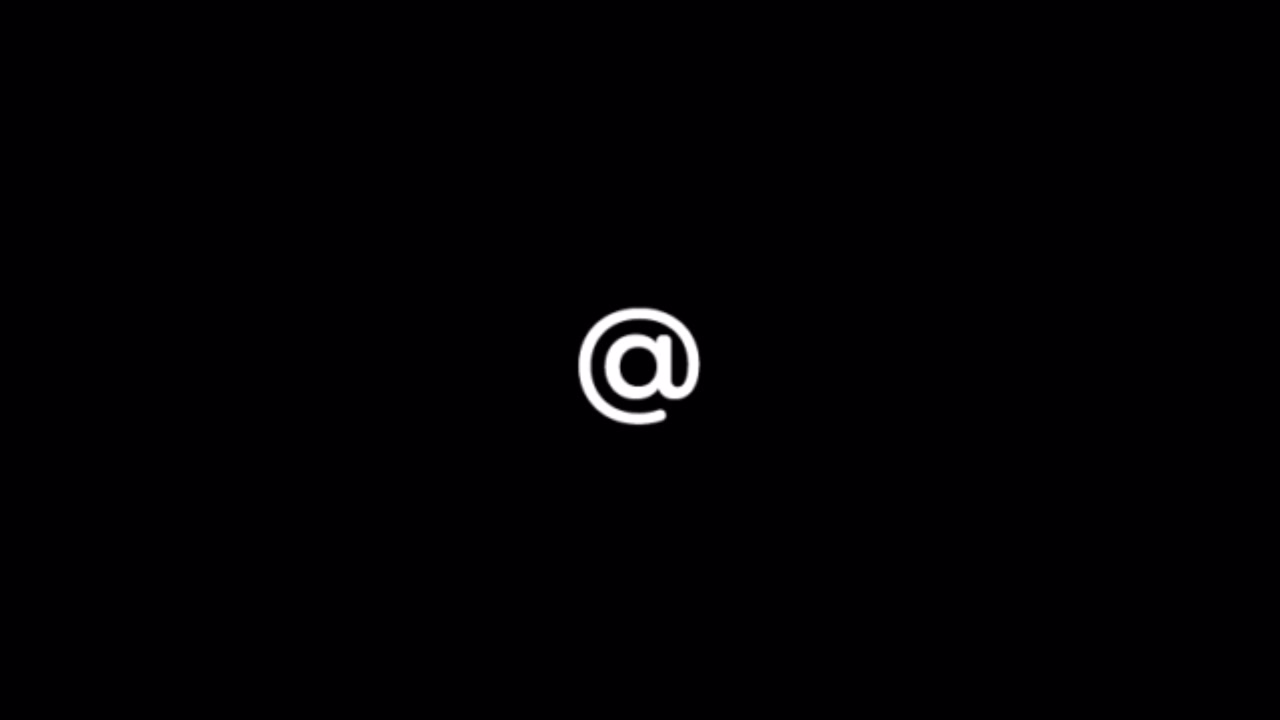 White At Symbol on Black Background
