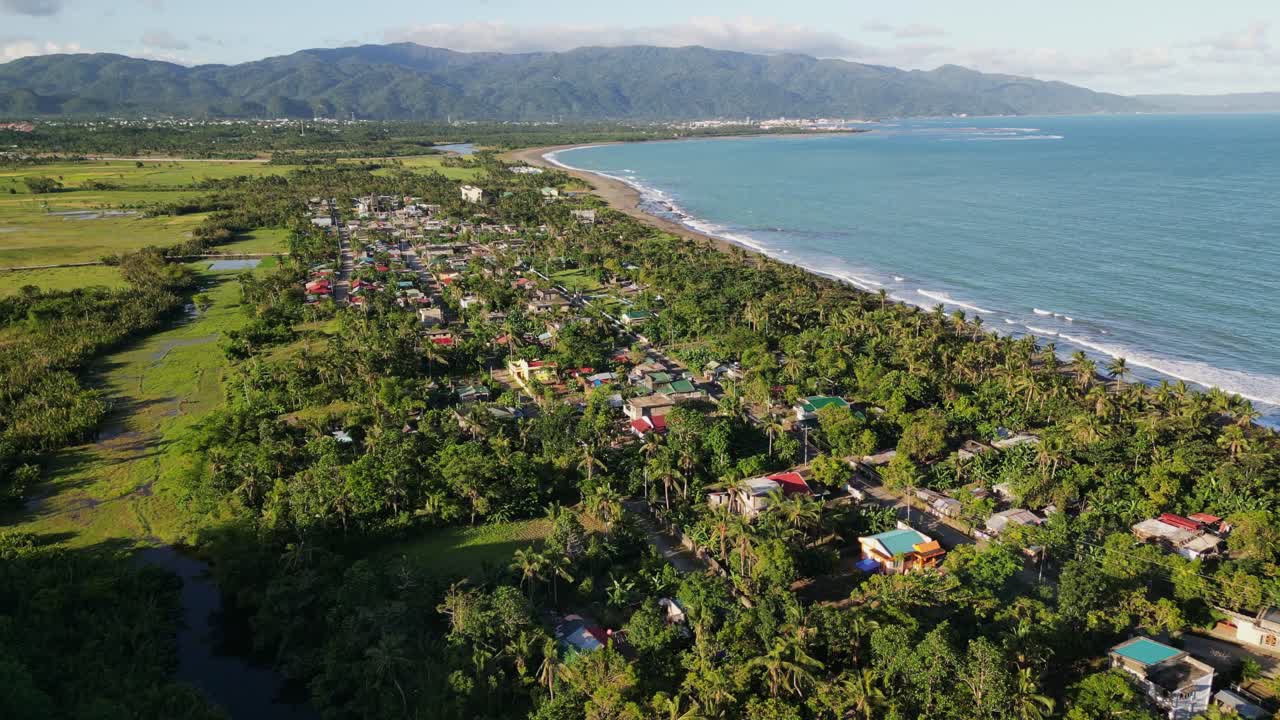 Coastal Village Antipolo del Sur With Lush Greenery, Mountain And Ocean Views. Virac, Catanduanes, Philippines. aerial shot