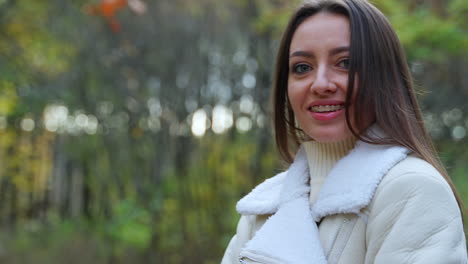 happy woman in park in autumn