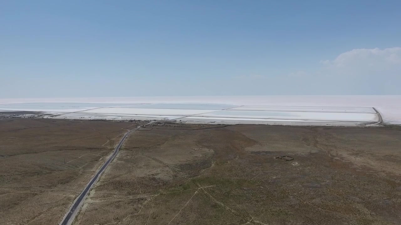 Aerial View of Vast Salt Lake and Desert Landscape